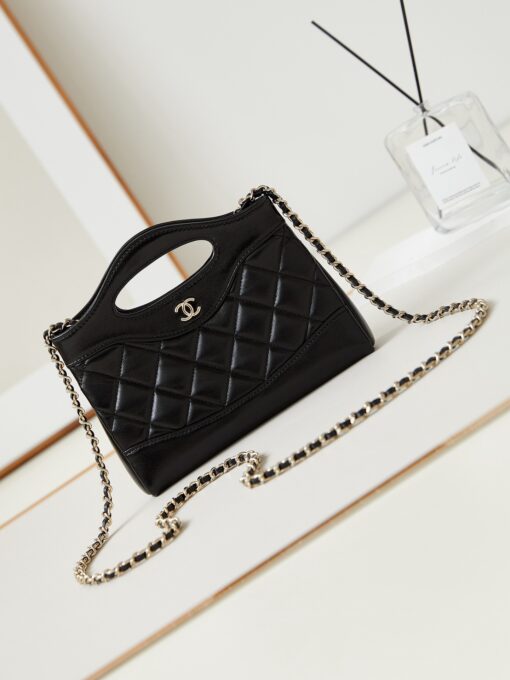 CHANEL 31 Nano Shopping Bag. Authentic quality luxury bag crafted in genuine leather comes with authenticity card, dust bag and gift bag. Small in size, grand in statement. A miniature marvel that captures the sophistication of CHANEL in its most playful form. Crafted with meticulous precision, this petite icon merges the timeless spirit of the CHANEL 31 with a modern twist on everyday elegance. Designed in supple lambskin and finished with gleaming gold-tone hardware, the Nano 31 doesn’t just carry your essentials — it carries your attitude. Whether worn crossbody, by hand, or dangling from the crook of your arm, this charming piece elevates every ensemble with a whisper of Parisian chic. Perfect for a night out or a day in the spotlight, it’s not just a bag — it’s your boldest accessory in its most compact form. Because luxury doesn't need to shout. Sometimes, it just needs to charm.