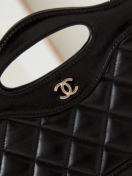 CHANEL 31 Nano Shopping Bag. Authentic quality luxury bag crafted in genuine leather comes with authenticity card, dust bag and gift bag. Small in size, grand in statement. A miniature marvel that captures the sophistication of CHANEL in its most playful form. Crafted with meticulous precision, this petite icon merges the timeless spirit of the CHANEL 31 with a modern twist on everyday elegance. Designed in supple lambskin and finished with gleaming gold-tone hardware, the Nano 31 doesn’t just carry your essentials — it carries your attitude. Whether worn crossbody, by hand, or dangling from the crook of your arm, this charming piece elevates every ensemble with a whisper of Parisian chic. Perfect for a night out or a day in the spotlight, it’s not just a bag — it’s your boldest accessory in its most compact form. Because luxury doesn't need to shout. Sometimes, it just needs to charm.