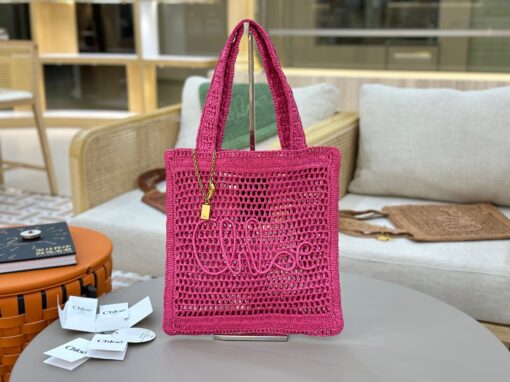 CHLOÉ Summer Banana Tote Bag. Authentic quality luxury bag crafted in genuine leather comes with authenticity card, dust bag and gift bag. Heritage in Hand: Where Artisan Craft Meets Summer Elegance. Introducing the Summer Banana Tote—an artisanal masterpiece crafted from raffia and calfskin by a single artisan over 4.5 days in partnership with Made For A Woman. This spacious tote is adorned with a handwritten signature inspired by Chloé’s rich heritage, while a playful dangling chain and delicate charms add the perfect finishing touch. A celebration of craftsmanship and effortless summer style.