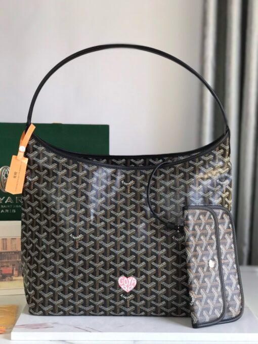 GOYARD Bohème Hobo Bag. Authentic quality luxury bag crafted in genuine leather comes with authenticity card, dust bag and gift bag. Wander Freely. Carry Elegantly. Introducing the Goyard Bohème Hobo Bag—a tribute to Parisian spirit and wanderlust. Inspired by the timber raftsmen’s humble travel pouches, this bag blends heritage storytelling with everyday luxury. Crafted to be exceptionally lightweight and flexible, it drapes effortlessly on your shoulder with a wide, comfortable handle designed for long city strolls or spontaneous weekend escapes. Its beauty lies not only in its sleek silhouette but also in its thoughtful functionality. The secure zip closure keeps your essentials safe, while the removable snap-fastened pouch doubles as a chic clutch or wallet—perfect for a quick dash or stylish switch-up. Whether you’re wandering through cobblestone streets or navigating your daily routine, the Bohème ensures your essentials are always within reach. This is not just a bag—it’s your elegant partner in carefree adventures.
