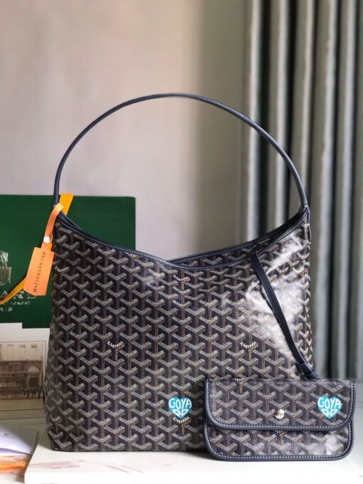 GOYARD Bohème Hobo Bag. Authentic quality luxury bag crafted in genuine leather comes with authenticity card, dust bag and gift bag. Wander Freely. Carry Elegantly. Introducing the Goyard Bohème Hobo Bag—a tribute to Parisian spirit and wanderlust. Inspired by the timber raftsmen’s humble travel pouches, this bag blends heritage storytelling with everyday luxury. Crafted to be exceptionally lightweight and flexible, it drapes effortlessly on your shoulder with a wide, comfortable handle designed for long city strolls or spontaneous weekend escapes. Its beauty lies not only in its sleek silhouette but also in its thoughtful functionality. The secure zip closure keeps your essentials safe, while the removable snap-fastened pouch doubles as a chic clutch or wallet—perfect for a quick dash or stylish switch-up. Whether you’re wandering through cobblestone streets or navigating your daily routine, the Bohème ensures your essentials are always within reach. This is not just a bag—it’s your elegant partner in carefree adventures.