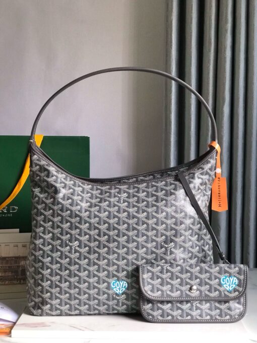 GOYARD Bohème Hobo Bag. Authentic quality luxury bag crafted in genuine leather comes with authenticity card, dust bag and gift bag. Wander Freely. Carry Elegantly. Introducing the Goyard Bohème Hobo Bag—a tribute to Parisian spirit and wanderlust. Inspired by the timber raftsmen’s humble travel pouches, this bag blends heritage storytelling with everyday luxury. Crafted to be exceptionally lightweight and flexible, it drapes effortlessly on your shoulder with a wide, comfortable handle designed for long city strolls or spontaneous weekend escapes. Its beauty lies not only in its sleek silhouette but also in its thoughtful functionality. The secure zip closure keeps your essentials safe, while the removable snap-fastened pouch doubles as a chic clutch or wallet—perfect for a quick dash or stylish switch-up. Whether you’re wandering through cobblestone streets or navigating your daily routine, the Bohème ensures your essentials are always within reach. This is not just a bag—it’s your elegant partner in carefree adventures.