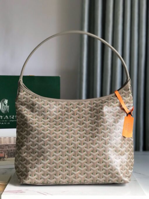 GOYARD Bohème Hobo Bag. Authentic quality luxury bag crafted in genuine leather comes with authenticity card, dust bag and gift bag. Wander Freely. Carry Elegantly. Introducing the Goyard Bohème Hobo Bag—a tribute to Parisian spirit and wanderlust. Inspired by the timber raftsmen’s humble travel pouches, this bag blends heritage storytelling with everyday luxury. Crafted to be exceptionally lightweight and flexible, it drapes effortlessly on your shoulder with a wide, comfortable handle designed for long city strolls or spontaneous weekend escapes. Its beauty lies not only in its sleek silhouette but also in its thoughtful functionality. The secure zip closure keeps your essentials safe, while the removable snap-fastened pouch doubles as a chic clutch or wallet—perfect for a quick dash or stylish switch-up. Whether you’re wandering through cobblestone streets or navigating your daily routine, the Bohème ensures your essentials are always within reach. This is not just a bag—it’s your elegant partner in carefree adventures.