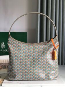 GOYARD Bohème Hobo Bag. Authentic quality luxury bag crafted in genuine leather comes with authenticity card, dust bag and gift bag. Wander Freely. Carry Elegantly. Introducing the Goyard Bohème Hobo Bag—a tribute to Parisian spirit and wanderlust. Inspired by the timber raftsmen’s humble travel pouches, this bag blends heritage storytelling with everyday luxury. Crafted to be exceptionally lightweight and flexible, it drapes effortlessly on your shoulder with a wide, comfortable handle designed for long city strolls or spontaneous weekend escapes. Its beauty lies not only in its sleek silhouette but also in its thoughtful functionality. The secure zip closure keeps your essentials safe, while the removable snap-fastened pouch doubles as a chic clutch or wallet—perfect for a quick dash or stylish switch-up. Whether you’re wandering through cobblestone streets or navigating your daily routine, the Bohème ensures your essentials are always within reach. This is not just a bag—it’s your elegant partner in carefree adventures. - KRIS + KIKO GOYARD Bohème Hobo Bag. Authentic quality luxury bag crafted in genuine leather comes with authenticity card, dust bag and gift bag. Wander Freely. Carry Elegantly. Introducing the Goyard Bohème Hobo Bag—a tribute to Parisian spirit and wanderlust. Inspired by the timber raftsmen’s humble travel pouches, this bag blends heritage storytelling with everyday luxury. Crafted to be exceptionally lightweight and flexible, it drapes effortlessly on your shoulder with a wide, comfortable handle designed for long city strolls or spontaneous weekend escapes. Its beauty lies not only in its sleek silhouette but also in its thoughtful functionality. The secure zip closure keeps your essentials safe, while the removable snap-fastened pouch doubles as a chic clutch or wallet—perfect for a quick dash or stylish switch-up. Whether you’re wandering through cobblestone streets or navigating your daily routine, the Bohème ensures your essentials are always within reach. This is not just a bag—it’s your elegant partner in carefree adventures.