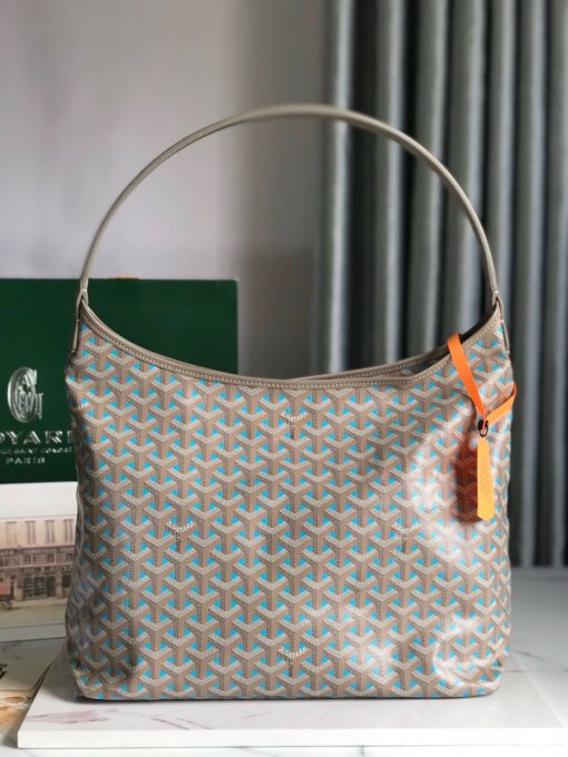 GOYARD Bohème Hobo Bag. Authentic quality luxury bag crafted in genuine leather comes with authenticity card, dust bag and gift bag. Wander Freely. Carry Elegantly. Introducing the Goyard Bohème Hobo Bag—a tribute to Parisian spirit and wanderlust. Inspired by the timber raftsmen’s humble travel pouches, this bag blends heritage storytelling with everyday luxury. Crafted to be exceptionally lightweight and flexible, it drapes effortlessly on your shoulder with a wide, comfortable handle designed for long city strolls or spontaneous weekend escapes. Its beauty lies not only in its sleek silhouette but also in its thoughtful functionality. The secure zip closure keeps your essentials safe, while the removable snap-fastened pouch doubles as a chic clutch or wallet—perfect for a quick dash or stylish switch-up. Whether you’re wandering through cobblestone streets or navigating your daily routine, the Bohème ensures your essentials are always within reach. This is not just a bag—it’s your elegant partner in carefree adventures.