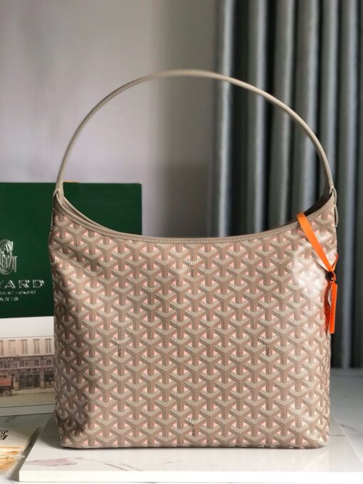 GOYARD Bohème Hobo Bag. Authentic quality luxury bag crafted in genuine leather comes with authenticity card, dust bag and gift bag. Wander Freely. Carry Elegantly. Introducing the Goyard Bohème Hobo Bag—a tribute to Parisian spirit and wanderlust. Inspired by the timber raftsmen’s humble travel pouches, this bag blends heritage storytelling with everyday luxury. Crafted to be exceptionally lightweight and flexible, it drapes effortlessly on your shoulder with a wide, comfortable handle designed for long city strolls or spontaneous weekend escapes. Its beauty lies not only in its sleek silhouette but also in its thoughtful functionality. The secure zip closure keeps your essentials safe, while the removable snap-fastened pouch doubles as a chic clutch or wallet—perfect for a quick dash or stylish switch-up. Whether you’re wandering through cobblestone streets or navigating your daily routine, the Bohème ensures your essentials are always within reach. This is not just a bag—it’s your elegant partner in carefree adventures.