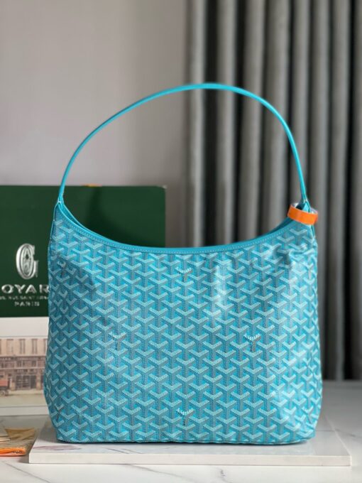 GOYARD Bohème Hobo Bag. Authentic quality luxury bag crafted in genuine leather comes with authenticity card, dust bag and gift bag. Wander Freely. Carry Elegantly. Introducing the Goyard Bohème Hobo Bag—a tribute to Parisian spirit and wanderlust. Inspired by the timber raftsmen’s humble travel pouches, this bag blends heritage storytelling with everyday luxury. Crafted to be exceptionally lightweight and flexible, it drapes effortlessly on your shoulder with a wide, comfortable handle designed for long city strolls or spontaneous weekend escapes. Its beauty lies not only in its sleek silhouette but also in its thoughtful functionality. The secure zip closure keeps your essentials safe, while the removable snap-fastened pouch doubles as a chic clutch or wallet—perfect for a quick dash or stylish switch-up. Whether you’re wandering through cobblestone streets or navigating your daily routine, the Bohème ensures your essentials are always within reach. This is not just a bag—it’s your elegant partner in carefree adventures.