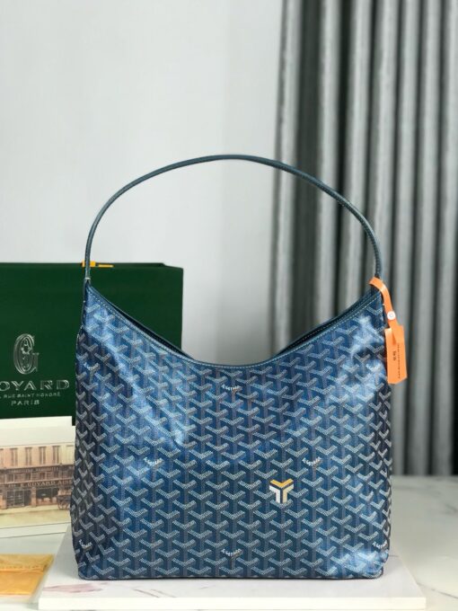 GOYARD Bohème Hobo Bag. Authentic quality luxury bag crafted in genuine leather comes with authenticity card, dust bag and gift bag. Wander Freely. Carry Elegantly. Introducing the Goyard Bohème Hobo Bag—a tribute to Parisian spirit and wanderlust. Inspired by the timber raftsmen’s humble travel pouches, this bag blends heritage storytelling with everyday luxury. Crafted to be exceptionally lightweight and flexible, it drapes effortlessly on your shoulder with a wide, comfortable handle designed for long city strolls or spontaneous weekend escapes. Its beauty lies not only in its sleek silhouette but also in its thoughtful functionality. The secure zip closure keeps your essentials safe, while the removable snap-fastened pouch doubles as a chic clutch or wallet—perfect for a quick dash or stylish switch-up. Whether you’re wandering through cobblestone streets or navigating your daily routine, the Bohème ensures your essentials are always within reach. This is not just a bag—it’s your elegant partner in carefree adventures.