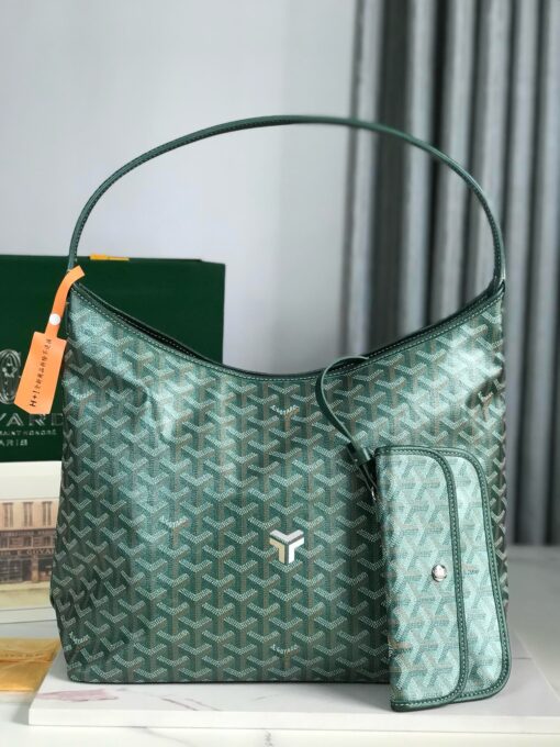 GOYARD Bohème Hobo Bag. Authentic quality luxury bag crafted in genuine leather comes with authenticity card, dust bag and gift bag. Wander Freely. Carry Elegantly. Introducing the Goyard Bohème Hobo Bag—a tribute to Parisian spirit and wanderlust. Inspired by the timber raftsmen’s humble travel pouches, this bag blends heritage storytelling with everyday luxury. Crafted to be exceptionally lightweight and flexible, it drapes effortlessly on your shoulder with a wide, comfortable handle designed for long city strolls or spontaneous weekend escapes. Its beauty lies not only in its sleek silhouette but also in its thoughtful functionality. The secure zip closure keeps your essentials safe, while the removable snap-fastened pouch doubles as a chic clutch or wallet—perfect for a quick dash or stylish switch-up. Whether you’re wandering through cobblestone streets or navigating your daily routine, the Bohème ensures your essentials are always within reach. This is not just a bag—it’s your elegant partner in carefree adventures.