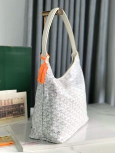 GOYARD Bohème Hobo Bag. Authentic quality luxury bag crafted in genuine leather comes with authenticity card, dust bag and gift bag. Wander Freely. Carry Elegantly. Introducing the Goyard Bohème Hobo Bag—a tribute to Parisian spirit and wanderlust. Inspired by the timber raftsmen’s humble travel pouches, this bag blends heritage storytelling with everyday luxury. Crafted to be exceptionally lightweight and flexible, it drapes effortlessly on your shoulder with a wide, comfortable handle designed for long city strolls or spontaneous weekend escapes. Its beauty lies not only in its sleek silhouette but also in its thoughtful functionality. The secure zip closure keeps your essentials safe, while the removable snap-fastened pouch doubles as a chic clutch or wallet—perfect for a quick dash or stylish switch-up. Whether you’re wandering through cobblestone streets or navigating your daily routine, the Bohème ensures your essentials are always within reach. This is not just a bag—it’s your elegant partner in carefree adventures. - KRIS + KIKO