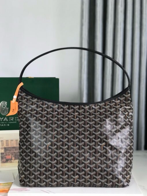 GOYARD Bohème Hobo Bag. Authentic quality luxury bag crafted in genuine leather comes with authenticity card, dust bag and gift bag. Wander Freely. Carry Elegantly. Introducing the Goyard Bohème Hobo Bag—a tribute to Parisian spirit and wanderlust. Inspired by the timber raftsmen’s humble travel pouches, this bag blends heritage storytelling with everyday luxury. Crafted to be exceptionally lightweight and flexible, it drapes effortlessly on your shoulder with a wide, comfortable handle designed for long city strolls or spontaneous weekend escapes. Its beauty lies not only in its sleek silhouette but also in its thoughtful functionality. The secure zip closure keeps your essentials safe, while the removable snap-fastened pouch doubles as a chic clutch or wallet—perfect for a quick dash or stylish switch-up. Whether you’re wandering through cobblestone streets or navigating your daily routine, the Bohème ensures your essentials are always within reach. This is not just a bag—it’s your elegant partner in carefree adventures.