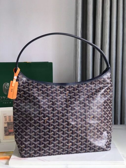 GOYARD Bohème Hobo Bag. Authentic quality luxury bag crafted in genuine leather comes with authenticity card, dust bag and gift bag. Wander Freely. Carry Elegantly. Introducing the Goyard Bohème Hobo Bag—a tribute to Parisian spirit and wanderlust. Inspired by the timber raftsmen’s humble travel pouches, this bag blends heritage storytelling with everyday luxury. Crafted to be exceptionally lightweight and flexible, it drapes effortlessly on your shoulder with a wide, comfortable handle designed for long city strolls or spontaneous weekend escapes. Its beauty lies not only in its sleek silhouette but also in its thoughtful functionality. The secure zip closure keeps your essentials safe, while the removable snap-fastened pouch doubles as a chic clutch or wallet—perfect for a quick dash or stylish switch-up. Whether you’re wandering through cobblestone streets or navigating your daily routine, the Bohème ensures your essentials are always within reach. This is not just a bag—it’s your elegant partner in carefree adventures.