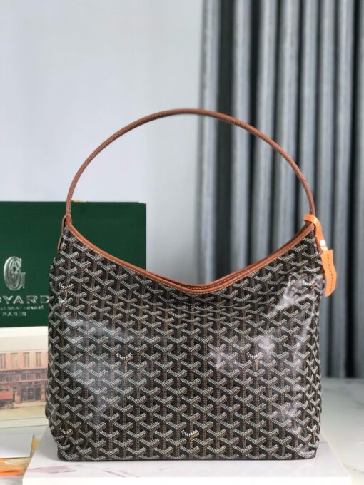 GOYARD Bohème Hobo Bag. Authentic quality luxury bag crafted in genuine leather comes with authenticity card, dust bag and gift bag. Wander Freely. Carry Elegantly. Introducing the Goyard Bohème Hobo Bag—a tribute to Parisian spirit and wanderlust. Inspired by the timber raftsmen’s humble travel pouches, this bag blends heritage storytelling with everyday luxury. Crafted to be exceptionally lightweight and flexible, it drapes effortlessly on your shoulder with a wide, comfortable handle designed for long city strolls or spontaneous weekend escapes. Its beauty lies not only in its sleek silhouette but also in its thoughtful functionality. The secure zip closure keeps your essentials safe, while the removable snap-fastened pouch doubles as a chic clutch or wallet—perfect for a quick dash or stylish switch-up. Whether you’re wandering through cobblestone streets or navigating your daily routine, the Bohème ensures your essentials are always within reach. This is not just a bag—it’s your elegant partner in carefree adventures.