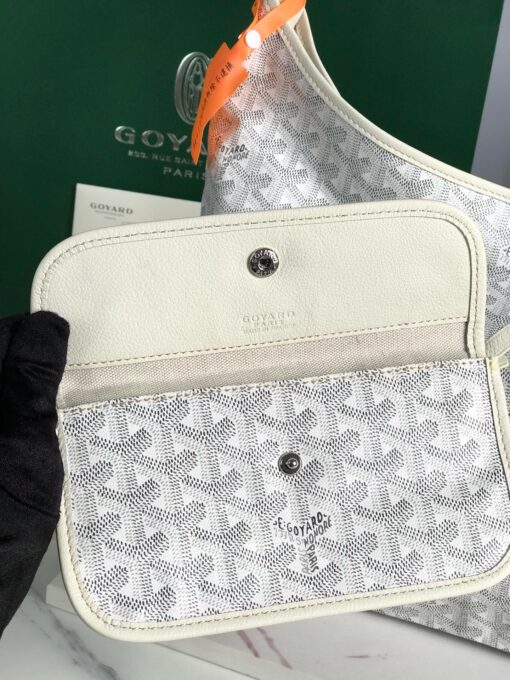 GOYARD Bohème Hobo Bag. Authentic quality luxury bag crafted in genuine leather comes with authenticity card, dust bag and gift bag. Wander Freely. Carry Elegantly. Introducing the Goyard Bohème Hobo Bag—a tribute to Parisian spirit and wanderlust. Inspired by the timber raftsmen’s humble travel pouches, this bag blends heritage storytelling with everyday luxury. Crafted to be exceptionally lightweight and flexible, it drapes effortlessly on your shoulder with a wide, comfortable handle designed for long city strolls or spontaneous weekend escapes. Its beauty lies not only in its sleek silhouette but also in its thoughtful functionality. The secure zip closure keeps your essentials safe, while the removable snap-fastened pouch doubles as a chic clutch or wallet—perfect for a quick dash or stylish switch-up. Whether you’re wandering through cobblestone streets or navigating your daily routine, the Bohème ensures your essentials are always within reach. This is not just a bag—it’s your elegant partner in carefree adventures.
