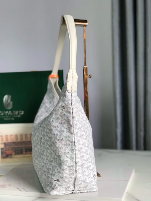 GOYARD Bohème Hobo Bag. Authentic quality luxury bag crafted in genuine leather comes with authenticity card, dust bag and gift bag. Wander Freely. Carry Elegantly. Introducing the Goyard Bohème Hobo Bag—a tribute to Parisian spirit and wanderlust. Inspired by the timber raftsmen’s humble travel pouches, this bag blends heritage storytelling with everyday luxury. Crafted to be exceptionally lightweight and flexible, it drapes effortlessly on your shoulder with a wide, comfortable handle designed for long city strolls or spontaneous weekend escapes. Its beauty lies not only in its sleek silhouette but also in its thoughtful functionality. The secure zip closure keeps your essentials safe, while the removable snap-fastened pouch doubles as a chic clutch or wallet—perfect for a quick dash or stylish switch-up. Whether you’re wandering through cobblestone streets or navigating your daily routine, the Bohème ensures your essentials are always within reach. This is not just a bag—it’s your elegant partner in carefree adventures.