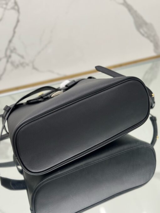 PRADA Buckle Small Leather Handbag. Authentic quality luxury bag crafted in genuine leather comes with authenticity card, dust bag and gift bag. Sophistication Meets Utility. Sleek, structured, and undeniably Prada — the Buckle Small Leather Handbag captures the brand’s signature balance of minimalist elegance and refined detail. Crafted in smooth leather with a buttery-soft nappa interior, this compact piece is a masterclass in functional luxury. A standout feature? Its interchangeable belt strap, adding a bold, modern twist to the timeless silhouette. Whether you're heading to a meeting or a soirée, this bag adapts seamlessly to your mood and moment. Finished with the embossed iconic PRADA logo, it’s a quiet statement of taste and distinction. A versatile companion for the woman who appreciates precision, polish, and just the right touch of edge.