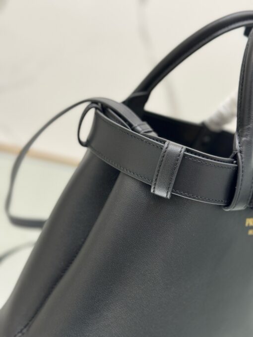 PRADA Buckle Small Leather Handbag. Authentic quality luxury bag crafted in genuine leather comes with authenticity card, dust bag and gift bag. Sophistication Meets Utility. Sleek, structured, and undeniably Prada — the Buckle Small Leather Handbag captures the brand’s signature balance of minimalist elegance and refined detail. Crafted in smooth leather with a buttery-soft nappa interior, this compact piece is a masterclass in functional luxury. A standout feature? Its interchangeable belt strap, adding a bold, modern twist to the timeless silhouette. Whether you're heading to a meeting or a soirée, this bag adapts seamlessly to your mood and moment. Finished with the embossed iconic PRADA logo, it’s a quiet statement of taste and distinction. A versatile companion for the woman who appreciates precision, polish, and just the right touch of edge.
