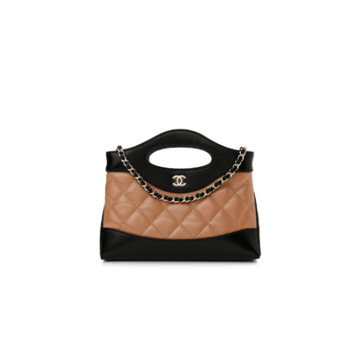 CHANEL 31 Nano Shopping Bag. Authentic quality luxury bag crafted in genuine leather comes with authenticity card, dust bag and gift bag. Small in size, grand in statement. A miniature marvel that captures the sophistication of CHANEL in its most playful form. Crafted with meticulous precision, this petite icon merges the timeless spirit of the CHANEL 31 with a modern twist on everyday elegance. Designed in supple lambskin and finished with gleaming gold-tone hardware, the Nano 31 doesn’t just carry your essentials — it carries your attitude. Whether worn crossbody, by hand, or dangling from the crook of your arm, this charming piece elevates every ensemble with a whisper of Parisian chic. Perfect for a night out or a day in the spotlight, it’s not just a bag — it’s your boldest accessory in its most compact form. Because luxury doesn't need to shout. Sometimes, it just needs to charm.