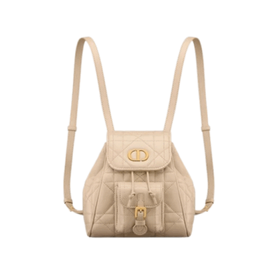 DIOR Small Caro Backpack. Authentic quality luxury bag crafted in genuine leather comes with authenticity card, dust bag and gift bag. Elegance Meets Effortless Edge. Elevate your everyday with the DIOR Small Caro Backpack — a flawless blend of modern femininity and iconic House craftsmanship. Luxuriously crafted in lambskin, its supple silhouette is enhanced by bold Macrocannage topstitching that whispers timeless Dior style. The antique gold-finish ‘CD’ clasp opens to a drawstring main compartment, perfectly balancing beauty and practicality. A discreet flap pocket keeps your daily essentials close at hand, while the top handle and adjustable leather straps offer versatile, all-day comfort. Whether slung over your shoulder or carried by hand, this petite powerhouse delivers Parisian polish in every step.