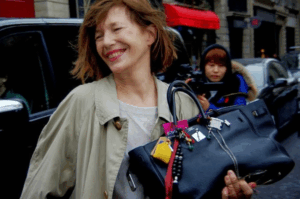 TikTok fashion influencer holding a neon green replica BIRKIN
