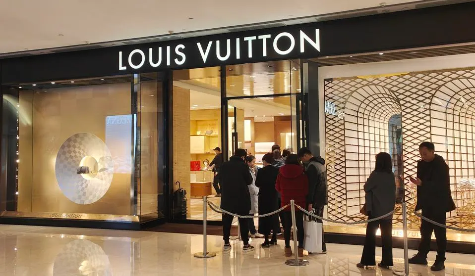 A screenshot of Walmart.com displaying a LOUIS VUITTON handbag among everyday items A screenshot of Walmart.com displaying a LOUIS VUITTON handbag among everyday items