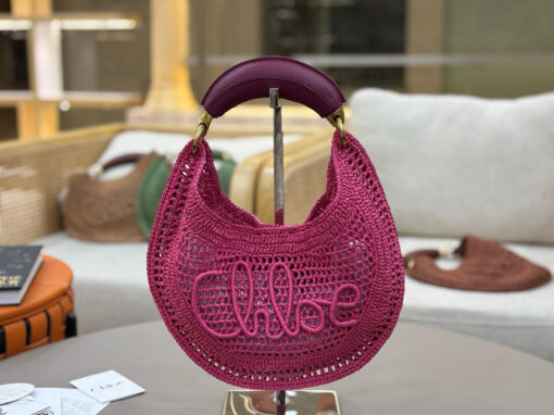CHLOÉ Summer Banana Hobo. Authentic quality luxury bag crafted in genuine leather comes with authenticity card, dust bag and gift bag. Artisanal Spirit, Curved in Style. Say hello to sunshine in bag form. The CHLOÉ Summer Banana Hobo Bag is a joyful blend of craftsmanship and creativity, handwoven over four days by a single artisan in collaboration with Made For A Woman. This is not just a bag—it’s a story stitched in raffia and trimmed in luxurious calfskin. Its curved, banana-inspired silhouette hugs the shoulder with ease, while the sculptural handle and handwritten signature nod to Chloé’s heritage of effortless elegance. Light, natural, and undeniably chic, it's the perfect companion for sun-soaked escapes or city strolls with a coastal state of mind. A celebration of craftsmanship, femininity, and the art of slow fashion.