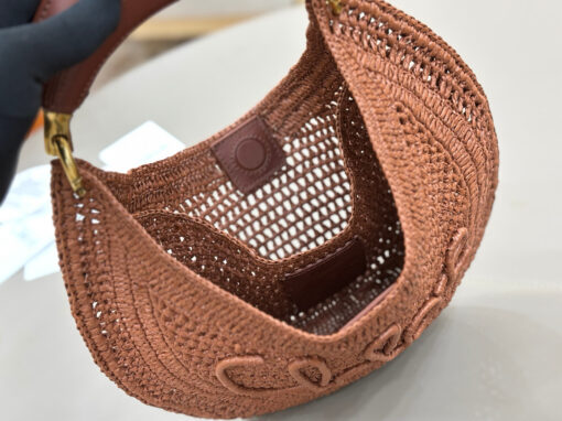 CHLOÉ Summer Banana Hobo. Authentic quality luxury bag crafted in genuine leather comes with authenticity card, dust bag and gift bag. Artisanal Spirit, Curved in Style. Say hello to sunshine in bag form. The CHLOÉ Summer Banana Hobo Bag is a joyful blend of craftsmanship and creativity, handwoven over four days by a single artisan in collaboration with Made For A Woman. This is not just a bag—it’s a story stitched in raffia and trimmed in luxurious calfskin. Its curved, banana-inspired silhouette hugs the shoulder with ease, while the sculptural handle and handwritten signature nod to Chloé’s heritage of effortless elegance. Light, natural, and undeniably chic, it's the perfect companion for sun-soaked escapes or city strolls with a coastal state of mind. A celebration of craftsmanship, femininity, and the art of slow fashion.