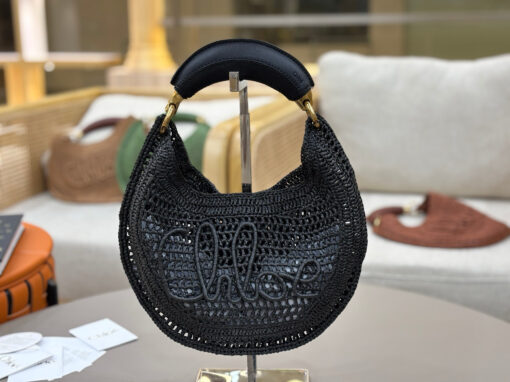 CHLOÉ Summer Banana Hobo. Authentic quality luxury bag crafted in genuine leather comes with authenticity card, dust bag and gift bag. Artisanal Spirit, Curved in Style. Say hello to sunshine in bag form. The CHLOÉ Summer Banana Hobo Bag is a joyful blend of craftsmanship and creativity, handwoven over four days by a single artisan in collaboration with Made For A Woman. This is not just a bag—it’s a story stitched in raffia and trimmed in luxurious calfskin. Its curved, banana-inspired silhouette hugs the shoulder with ease, while the sculptural handle and handwritten signature nod to Chloé’s heritage of effortless elegance. Light, natural, and undeniably chic, it's the perfect companion for sun-soaked escapes or city strolls with a coastal state of mind. A celebration of craftsmanship, femininity, and the art of slow fashion.