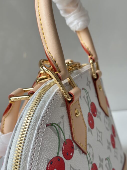 LV x TM Alma BB. Authentic quality luxury bag crafted in genuine leather comes with authenticity card, dust bag and gift bag. A Joyful Icon Reimagined. Playful, artistic, and instantly iconic—the Alma BB returns in a joyful re-edition as part of the celebrated LV x Murakami collection. This petite masterpiece blends the timeless Art Deco-inspired silhouette with Takashi Murakami’s signature whimsy, splashing the House’s Monogram canvas with bold, cherry-bright motifs. Crafted with natural leather accents and finished with polished gold-tone hardware, it features structured Toron top handles and a charming bow-shaped keybell that adds just the right amount of flirt. Compact yet attention-commanding, the Alma BB is a true collectible—full of joy, color, and unmistakable LV heritage. Carry art. Wear happiness. Make a statement.