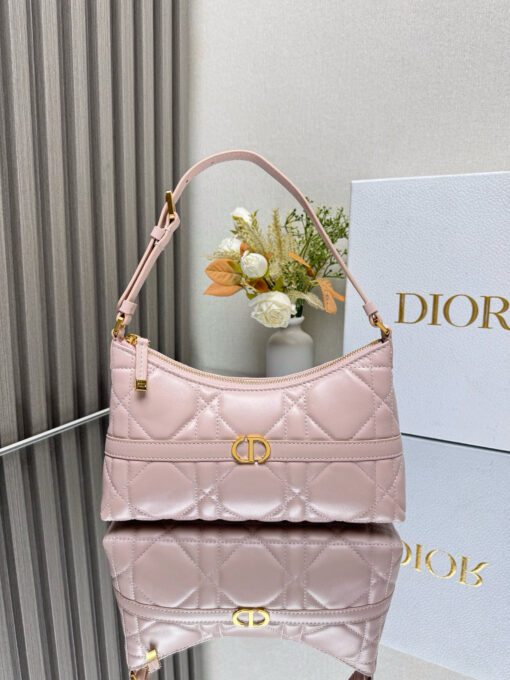 DIOR Cigale Mini Bag. Authentic quality luxury bag crafted in genuine leather comes with authenticity card, dust bag and gift bag. A Contemporary Classic in the Making. Meet the latest gem in the Miss Caro line: the Dior Cigale Mini Bag—a sleek, structured piece that blends timeless elegance with modern attitude. Crafted in supple lambskin and elevated by bold Macrocannage topstitching, this petite powerhouse exudes refined femininity from every angle. The standout tonal strap, adorned with an antique gold-finish CD signature, adds a sculptural touch to its streamlined silhouette. A secure zip compartment keeps your essentials close, while the adjustable leather strap offers effortless over-the-shoulder chic. Lightweight, luxurious, and unmistakably Dior—this is the mini bag that delivers big on style. Miss Caro’s modern muse has arrived.