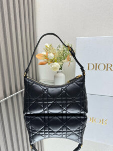 DIOR Cigale Mini Bag. Authentic quality luxury bag crafted in genuine leather comes with authenticity card, dust bag and gift bag. A Contemporary Classic in the Making. Meet the latest gem in the Miss Caro line: the Dior Cigale Mini Bag—a sleek, structured piece that blends timeless elegance with modern attitude. Crafted in supple lambskin and elevated by bold Macrocannage topstitching, this petite powerhouse exudes refined femininity from every angle. The standout tonal strap, adorned with an antique gold-finish CD signature, adds a sculptural touch to its streamlined silhouette. A secure zip compartment keeps your essentials close, while the adjustable leather strap offers effortless over-the-shoulder chic. Lightweight, luxurious, and unmistakably Dior—this is the mini bag that delivers big on style. Miss Caro’s modern muse has arrived. - KRIS + KIKO DIOR Cigale Mini Bag. Authentic quality luxury bag crafted in genuine leather comes with authenticity card, dust bag and gift bag. A Contemporary Classic in the Making. Meet the latest gem in the Miss Caro line: the Dior Cigale Mini Bag—a sleek, structured piece that blends timeless elegance with modern attitude. Crafted in supple lambskin and elevated by bold Macrocannage topstitching, this petite powerhouse exudes refined femininity from every angle. The standout tonal strap, adorned with an antique gold-finish CD signature, adds a sculptural touch to its streamlined silhouette. A secure zip compartment keeps your essentials close, while the adjustable leather strap offers effortless over-the-shoulder chic. Lightweight, luxurious, and unmistakably Dior—this is the mini bag that delivers big on style. Miss Caro’s modern muse has arrived.