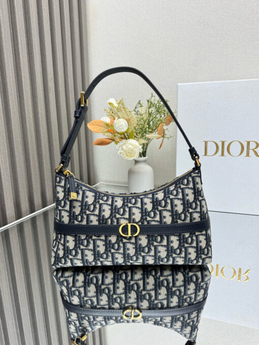 DIOR Cigale Mini Bag. Authentic quality luxury bag crafted in genuine leather comes with authenticity card, dust bag and gift bag. A Contemporary Classic in the Making. Meet the latest gem in the Miss Caro line: the Dior Cigale Mini Bag—a sleek, structured piece that blends timeless elegance with modern attitude. Crafted in supple lambskin and elevated by bold Macrocannage topstitching, this petite powerhouse exudes refined femininity from every angle. The standout tonal strap, adorned with an antique gold-finish CD signature, adds a sculptural touch to its streamlined silhouette. A secure zip compartment keeps your essentials close, while the adjustable leather strap offers effortless over-the-shoulder chic. Lightweight, luxurious, and unmistakably Dior—this is the mini bag that delivers big on style. Miss Caro’s modern muse has arrived.