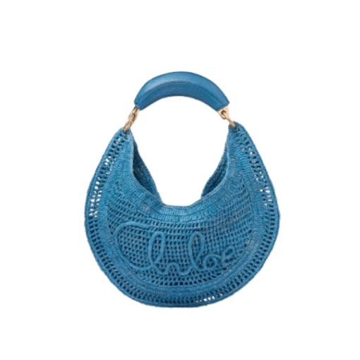 CHLOÉ Summer Banana Hobo. Authentic quality luxury bag crafted in genuine leather comes with authenticity card, dust bag and gift bag. Artisanal Spirit, Curved in Style. Say hello to sunshine in bag form. The CHLOÉ Summer Banana Hobo Bag is a joyful blend of craftsmanship and creativity, handwoven over four days by a single artisan in collaboration with Made For A Woman. This is not just a bag—it’s a story stitched in raffia and trimmed in luxurious calfskin. Its curved, banana-inspired silhouette hugs the shoulder with ease, while the sculptural handle and handwritten signature nod to Chloé’s heritage of effortless elegance. Light, natural, and undeniably chic, it's the perfect companion for sun-soaked escapes or city strolls with a coastal state of mind. A celebration of craftsmanship, femininity, and the art of slow fashion.