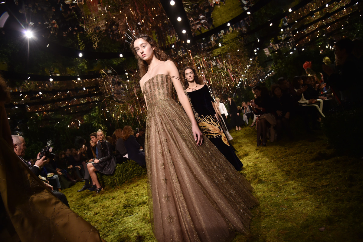 A runway show that celebrates female strength and creativity, where each model's gown reflects the spirit of modern feminist elegance. A runway show that celebrates female strength and creativity, where each model's gown reflects the spirit of modern feminist elegance.